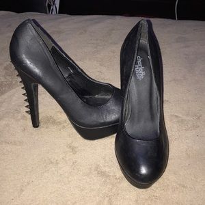 Black pumps with silver spikes on heel